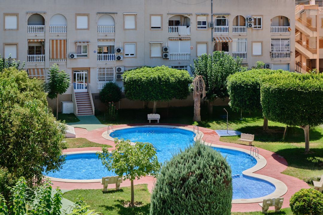 Reina Rosa apartment balcony overlooking the pool